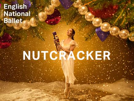 Ballerina holds a nutcracker doll