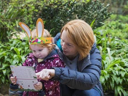 Child and adult with Easter trail sheet at Hinton Ampner