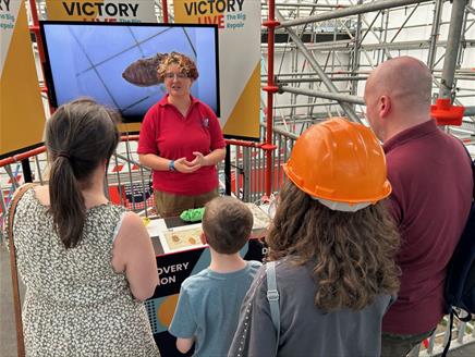 Female conservator explaining the conservation process