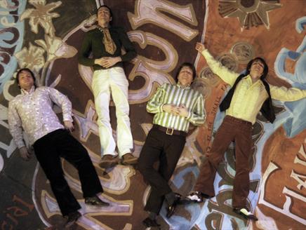 Photograph showing the four members of The Small Fakers