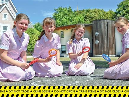 Four girls take part in the Forensic Science Trail at Portsmouth High School