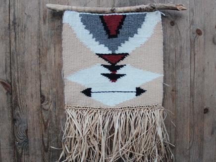 A weaved hanging decoration made on a loom