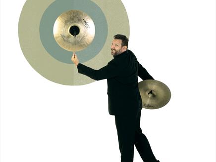 BSO Musician balancing a cymbal on his finger