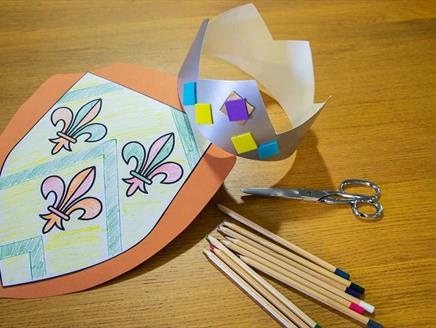 Paper crown and shield made at the Mary Rose Museum