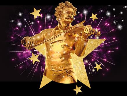 A golden statue of conductor Johann Strauss II, surrounded by stars