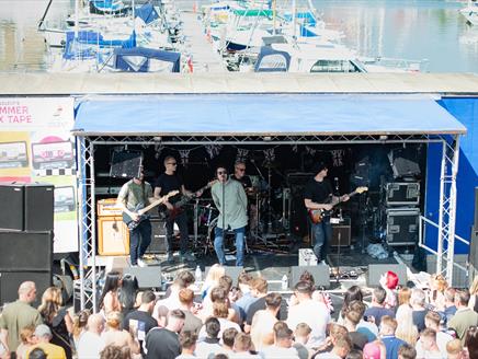 Oasis tribute 'The Supersonics' at a tributes event at Port Solent, playing a stage near the waterfront.