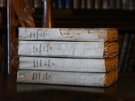 Early-edition volumes of Austen's Pride & Prejudice and Northanger Abbey.