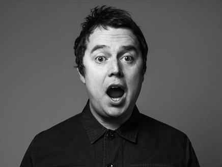 Black and white photograph of Paul McCaffrey
