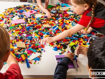 Children playing with LEGO at a Bricks McGee event