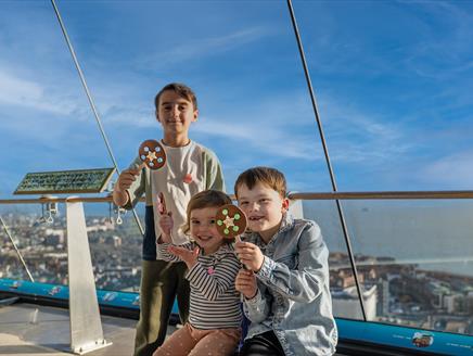Children with their chocolate lollies at Spinnaker Tower