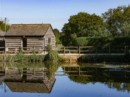 Exterior and reflection of The Little Granary