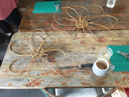 Willow flowers on wooden table