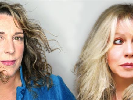 Two women with long hair face the camera.