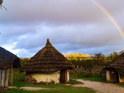 A rainbow plays over Butser Ancient Farm.