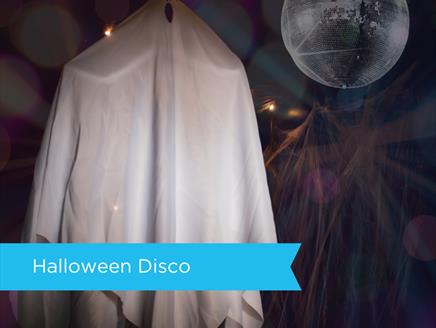 spooky ghost dancing under a disco ball at sky park farms mini halloween disco