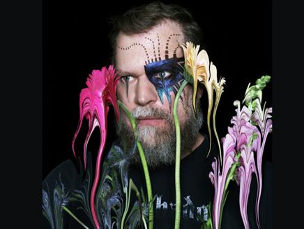 Picture of singer John Grant with flowers.