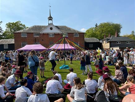 Children learning Maypole dancing at Whitchurch Folk Festival 2024