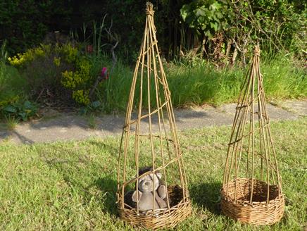two willow sweet pea basket one has a toy hedgehog in
