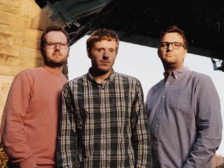 The Young'uns stand next to each other and look towards the camera.