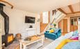 Living room with wood burning stove in The Chapel