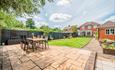 Large garden with seating area at Holly House - a New Forest Cottage