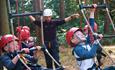 Children enjoying ropes course with New Forest Activities