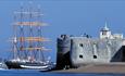 Image of visitors watching naval vessels from the Round Tower