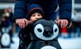 Child with a penguin-shaped skate aid at Ice Skate Portsmouth - credit Ice Skate Portsmouth and Vernon Nash