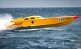 Photograph of a yellow boat racing through the water by Tracey Beer Photography