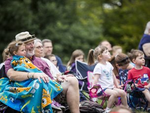 Families enjoy an outdoor event.