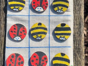 Picture of drawstring bag with wooden disc pieces - decorated as bees & ladybugs