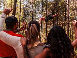 Adult on a zip line at Go Ape