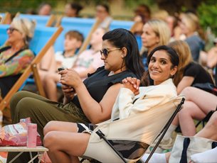 A crowd enjoys an outdoor event.