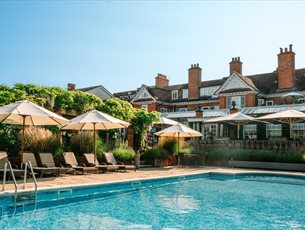 Outside swimming pool and decking area at Chewton Glen Hotel & Spa
