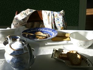 The dining table at Jane Austen's House laid for breakfast. 