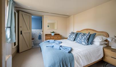 A bedroom at Carrington Stables - a New Forest Holiday Cottage
