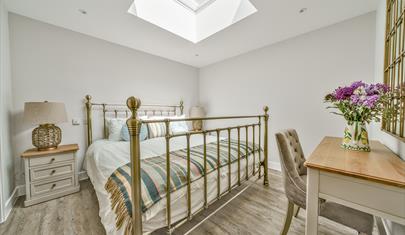 A bedroom at The Potting Shed - a New Forest Holiday Cottage