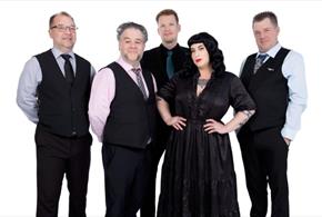 Press shot for Davina and the Vagabonds, featuring the five members of the band against a white background