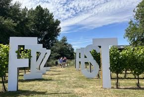 Fizz Fest letters in a vineyard