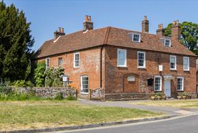 Jane Austen's House - a red bricked house with multiple chimneys