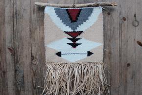 A weaved hanging decoration made on a loom