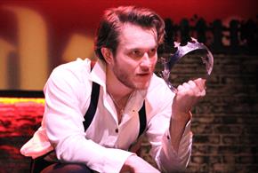 Performer from the Dickens Theatre Company performing in Macbeth