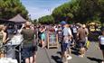 People enjoying sunny weather and food along Avenue de Caen for Southsea Food Festival