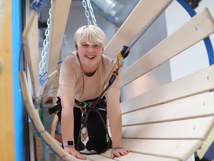 High Ropes smiling girl in tunnel