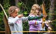 Children taking part in archery with New Forest Activities