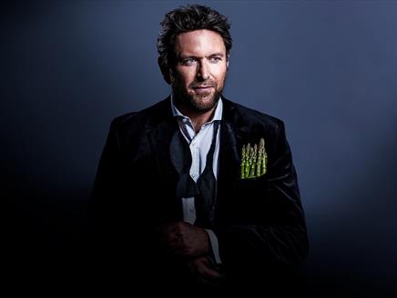 Poster for James Martin Live showing the chef in a suit jacket with asparagus spears in place of a pocket square