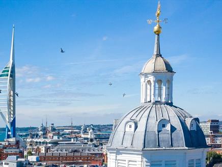 Top of Portsmouth Cathedral from the air, with the Spinnaker Tower in the background