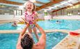 Child enjoying indoor swimming pool at Sandy Balls in the New Forest