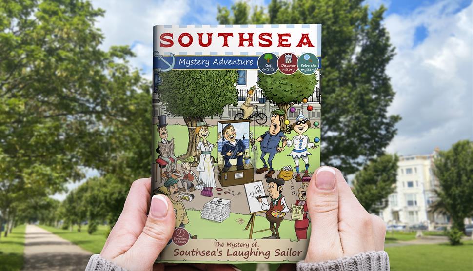 Southsea Treasure Hunt Adventure: The Mystery of The Laughing Sailor guide book in hand