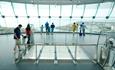 Family walking across the glass floor at Emirates Spinnaker Tower